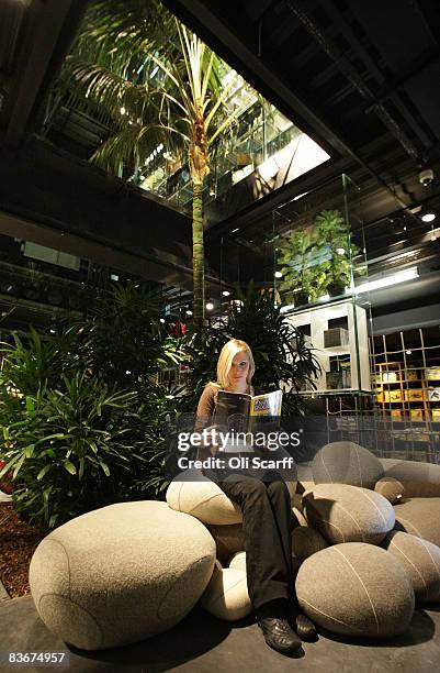 Kasia Kuros reads a copy of National Geographic magazine in the National Geographic store on Regent Street on November 13, 2008 in London, England....