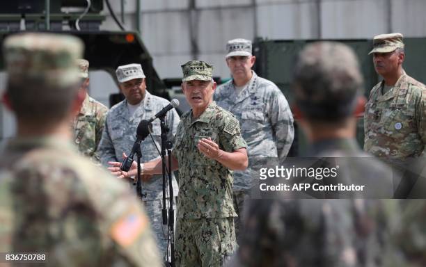 Pacific Command Commander Admiral Harry Harris Jr. Answers a reporter's question as US and South Korean soldiers listen during a press conference as...
