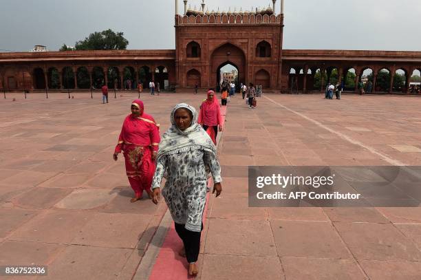 Indian Muslim women visit the Jama Masjid mosque in New Delhi on August 22, 2017. India's top court on August 22 banned a controversial Islamic...