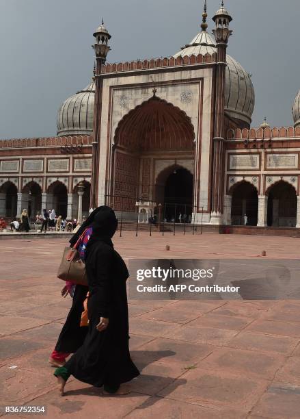 An Indian Muslim woman visits the Jama Masjid mosque in New Delhi on August 22, 2017. India's top court on August 22 banned a controversial Islamic...