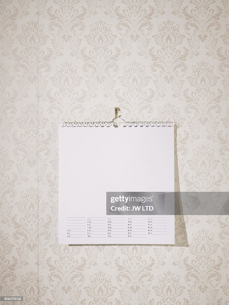 Blank calendar against wallpaper