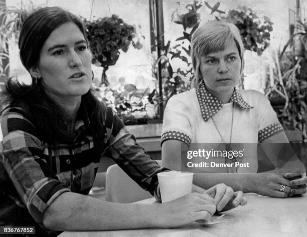 Susan Schwartz, Left, And Mrs. Carol Ihli Talk About Plant Therapy behind them is the wall of hanging plants in the occupational-therapy workshop at...