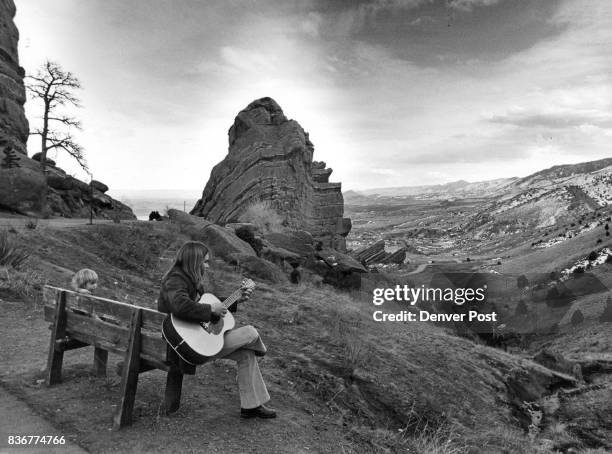 Enjoying The Serenity Of Red Rocks Will Porter sings to his 2-1/2-year-old son in the serenity of the Red Rocks amphitheater Thursday as the...
