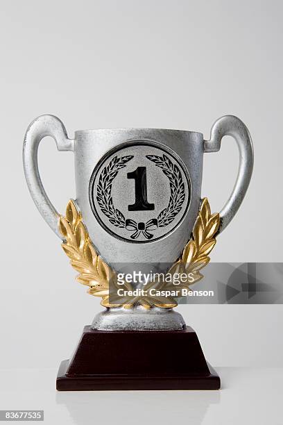 first place trophy - gold trophy stock pictures, royalty-free photos & images