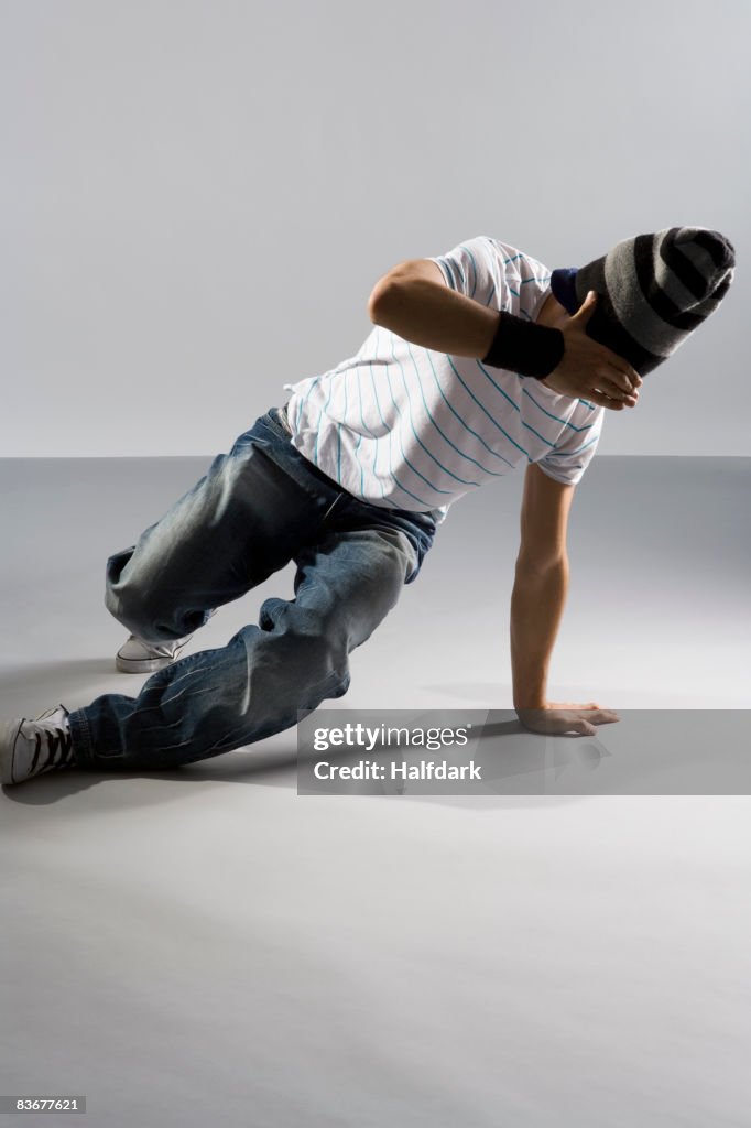 A B-boy trying to do a breakdance move