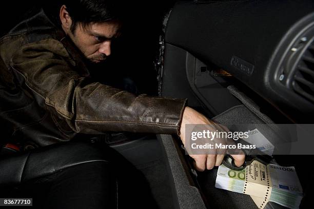 a man reaching for a gun - handschuhfach stock-fotos und bilder