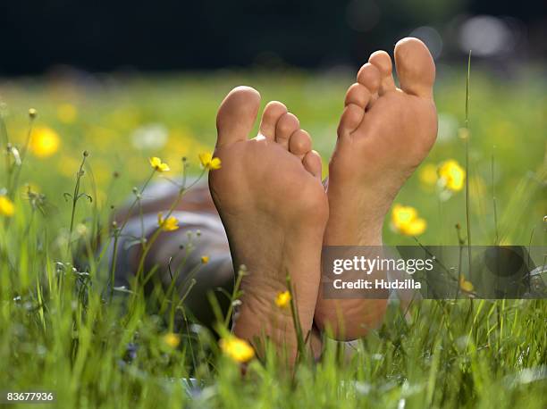 the soles of a person's bare feet, close up - bare feet stock-fotos und bilder