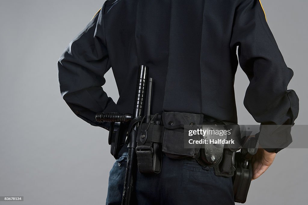 Police Officer Rear Rear View Of A Police Officer Carrying Weapons High-Res Stock Photo ...