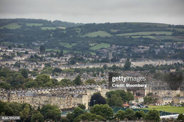 Fields and woodland stand beyond rows of residential terraced housing in Bath, U.K. On Monday, Aug. 21, 2017. U.K. Property prices stagnated in July...