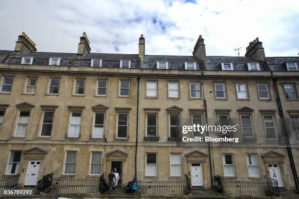 Delivery men carry a washing machine into a terraced house on a suburban street in Bath, U.K. On Monday, Aug. 21, 2017. U.K. Property prices...