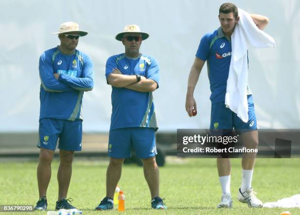 Australian bowling coach Ryan Harris and Australian coach Darren Lehman talk with Josh Hazlewood during an Australian Test team nets session at...