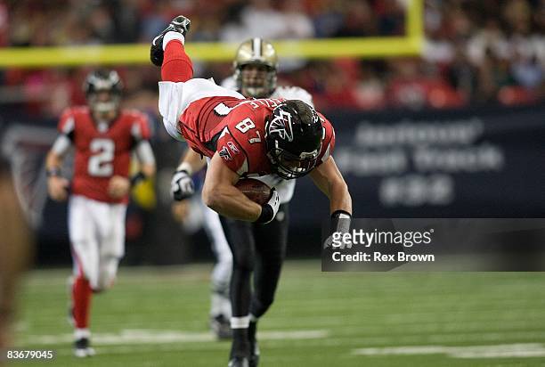 Justin Peelle of the Atlanta Falcons dives for a first down against the New Orleans Saints at Georgia Dome on November 9, 2008 in Atlanta, Georgia.