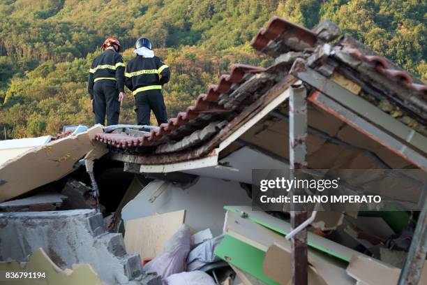 Italian firemen search through rubble of a collapsed house in Ischia, on August 22 after an earthquake hit the popular Italian tourist island off the...