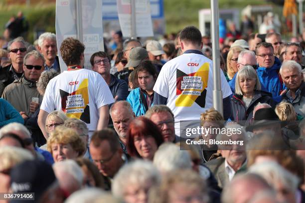 Supporters look on during a Christian Democratic Union election campaign stop in Saint Peter-Ording, Germany, on Monday, Aug. 21, 2017. Germany's...