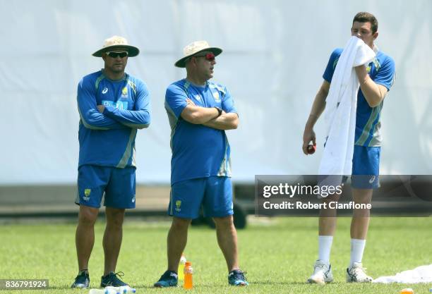 Australian bowling coach Ryan Harris and Australian coach Darren Lehman talk with Josh Hazlewood during an Australian Test team nets session at...