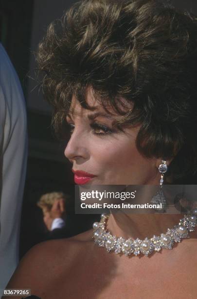 British actress and author Joan Collins attends the Emmy Awards held at the Pasadena Civic Auditorium, Pasadena, California, September 22, 1985.