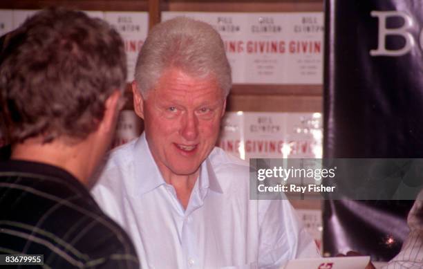 Former US President Bill Clinton at a book signing session for his new book 'Giving,' at an independent bookstore 'Books & Books,' Coral Gables,...