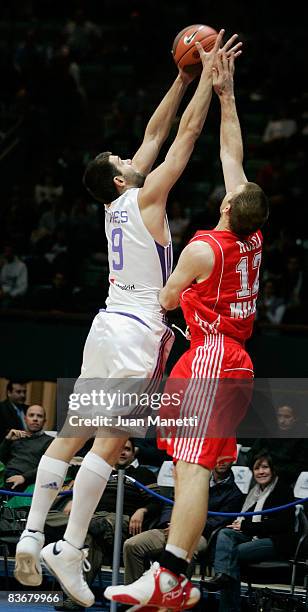 Felipe Reyes, #9 of Real Madrid and Richard Mason Rocca, #12 of AJ Milano in action during the Euroleague Basketball Game 4 match between Real Madrid...