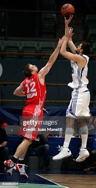 Felipe Reyes, #9 of Real Madrid and Richard Mason Rocca, #12 of AJ Milano in action during the Euroleague Basketball Game 4 match between Real Madrid...