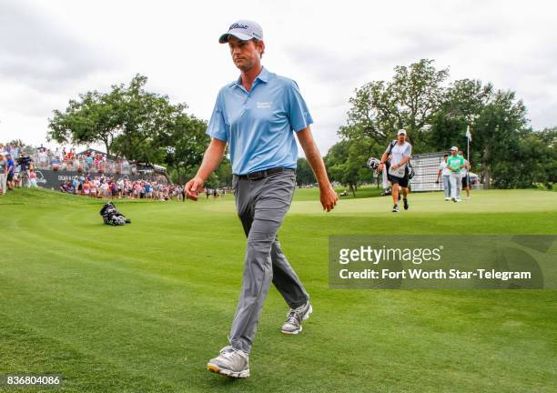 Webb Simpson leaves the 18th green after finishing 5th during the final round of the Dean & DeLuca Invitational golf tournament on Sunday, May 28,...