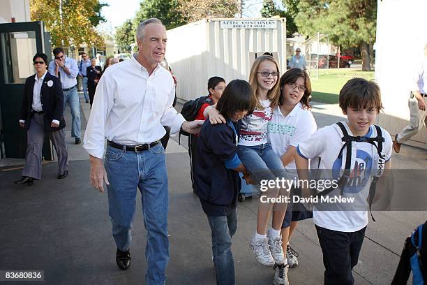 Secretary of the Interior Dirk Kempthorne evacuates a classroom with students carrying a classmate who pretends to be injured at Stevenson Elementary...