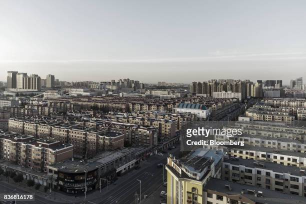 Residential buildings stand in Baotou, Inner Mongolia, China, on Friday, Aug. 11, 2017. China's economy showed further signs of entering a...