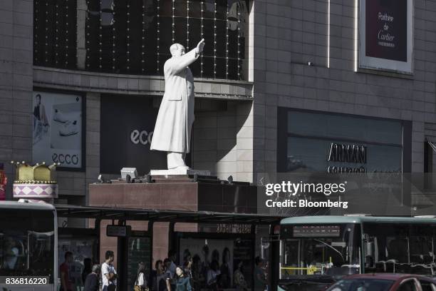 Statue of Mao Zedong stands on display in front of the Baotou Victory Shopping Mall in Baotou, Inner Mongolia, China, on Friday, Aug. 11, 2017....