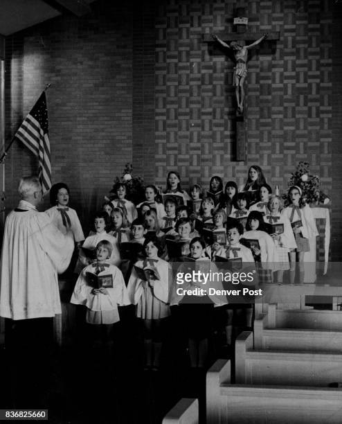 Notre Dame Church 5th Group shot of choir-Father Richard C. Hiesten directed Young voices in Notre Dame church choir join in Christmas Songs Credit:...