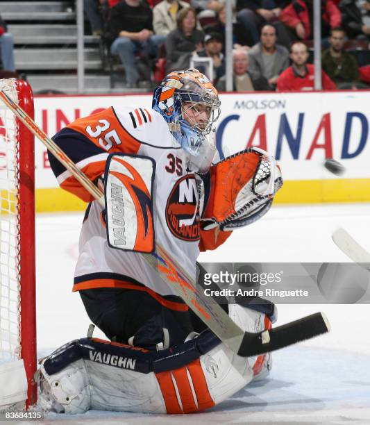 Joey MacDonald of the New York Islanders focuses on a shot and makes a save against the Ottawa Senators at Scotiabank Place on November 13, 2008 in...
