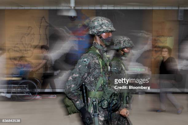 Soldiers participate in an anti-terror drill on the sidelines of the Ulchi Freedom Guardian military exercises at a subway station in Seoul, South...