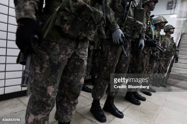 Soldiers participate in an anti-terror drill on the sidelines of the Ulchi Freedom Guardian military exercises at a subway station in Seoul, South...