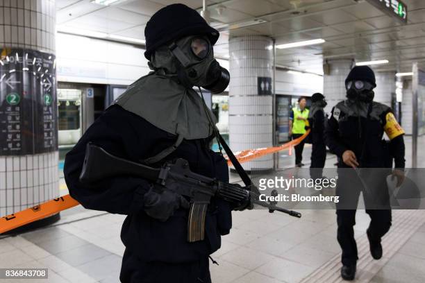 Police officers participate in an anti-terror drill on the sidelines of the Ulchi Freedom Guardian military exercises at a subway station in Seoul,...