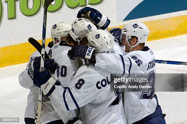 Carlo Colaiacovo, Anton Stralman and Nik Antropov and their teammates from the Toronto Maple Leafs celebrate a late second period goal against the...