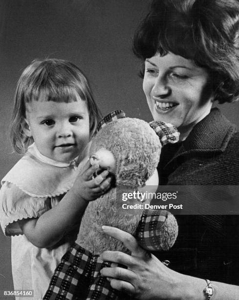 Mother Abandons Baby Miss Debbie Nicholson of the Denver Child Welfare**Bureau holds a little girl named Kelley who was abandoned by her mother in...