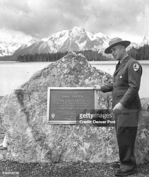 Plaque Honors Trapper Teton Park Supt. Frank R. Oberhansley views the plaque honoring John Colter, early - day trapper who is credited with...