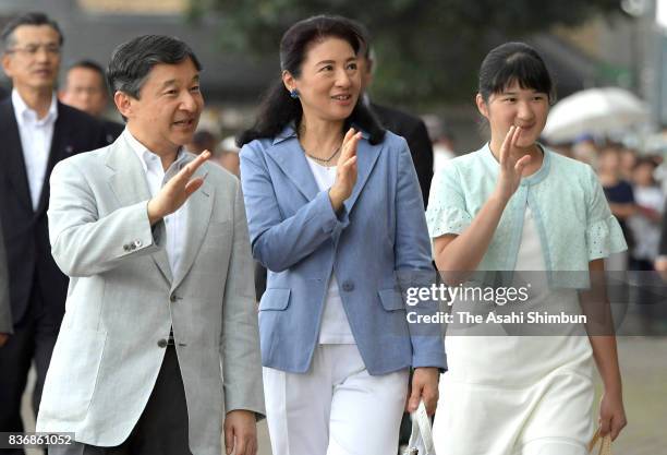 Crown Prince Naruhito, Crown Princess Masako and their daughter Aiko wave to well-wishers on arrival at JR Nasushiobara Station on the way to the...