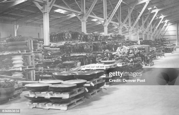 Ready To Go-Plows, tractors, combines and other farm machines are stored in this machinery warehouse at International Harvester’s new parts depot at...