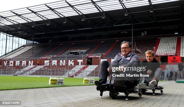 Former Formula One Worldchampion Nico Rosberg of Germany and Ewald Lienen, technical director of St. Pauli in action during the viva con aqua social...