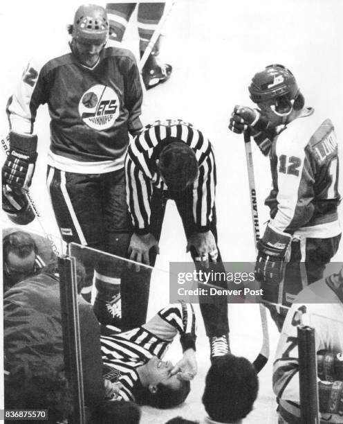 Ice Hockey - Colorado Rockies Referee Ron Fournier Attracts Crowd at Rockies Game He was struck on leg by puck but, despite grimace, returned to...