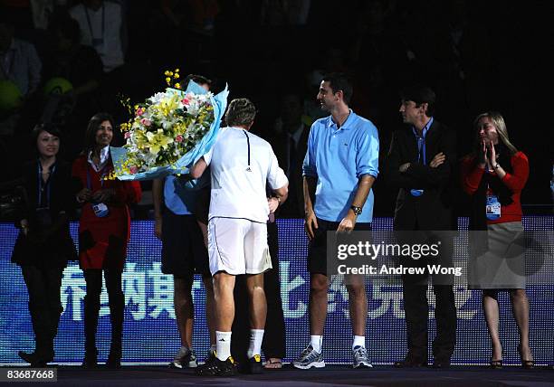 Jonas Bjorkman of Sweden bids farewell to the ATP staff during a ceremony to announce his retirement after his last double match in the Tennis...