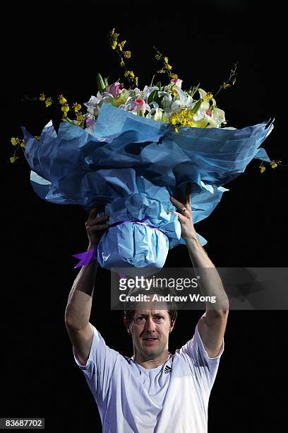 Jonas Bjorkman of Sweden acknowledges the crowd during a ceremony to announce his retirement after his last double match in the Tennis Masters Cup...