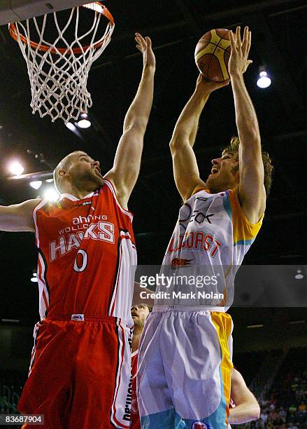 Larry Davidson of the Hawks blocks Casey Frank of the Blaze during the round nine NBL match between the Wollongong Hawks and the Gold Coast Blaze at...