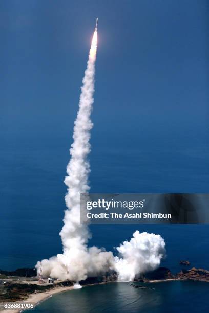 In this aerial image, the H-IIA Launch Vehicle No.35 lifts off from the launch pad at the Japan Aerospace Exploration Agency Takegashima Space Center...