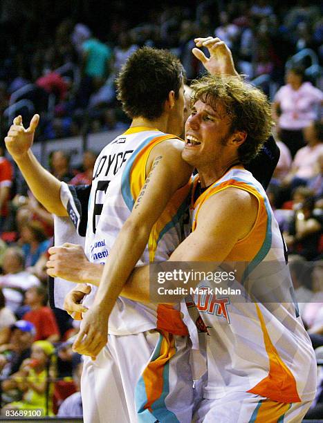 Casey Frank of the Blaze and team-mate Daniel Joyce celebrate victory after the round nine NBL match between the Wollongong Hawks and the Gold Coast...