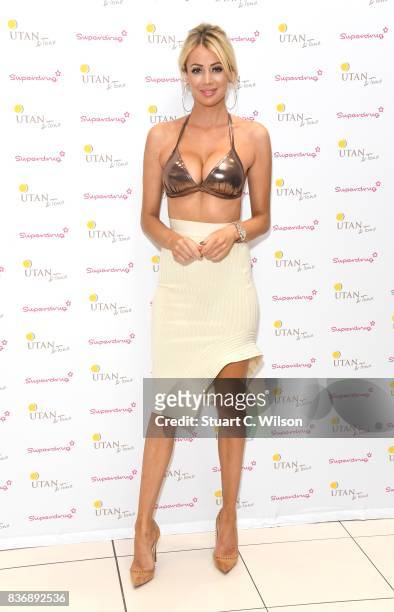 Olivia Attwood celebrates the nationwide launch of 'UTan & Tone' into Superdrug stores at Superdrug, Westfield White City on August 22, 2017 in...