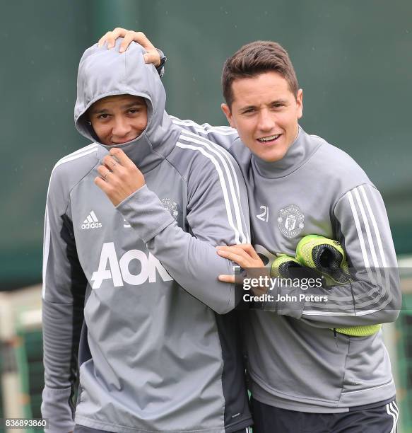 Marcos Rojo and Ander Herrera of Manchester United in action during a first team training session at Aon Training Complex on August 22, 2017 in...