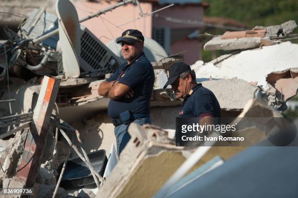 Rescuers dig through the rubble during a search for two missing children on August 22, 2017 in Casamicciola Terme, Italy. A magnitude-4.0 earthquake...