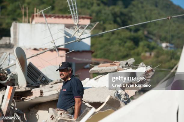 Rescuers dig through the rubble during a search for two missing children on August 22, 2017 in Casamicciola Terme, Italy. A magnitude-4.0 earthquake...