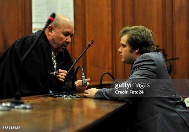 Henri van Breda along with advocate Pieter Botha seen in court on August 21, 2017 in Cape Town South Africa. Van Bredas funds for the court case is...