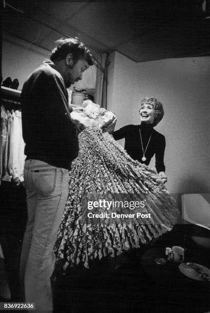 Actress Jane Powell displays for "Alice Blue Gown" to a member of the wardrobe department prior to opening. She's noted for her movie assignments,...